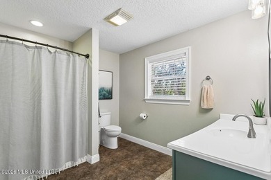 Situated on a spacious double lot in the desirable Diamondhead on Diamondhead Country Club in Mississippi - for sale on GolfHomes.com, golf home, golf lot