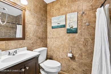 Situated on a spacious double lot in the desirable Diamondhead on Diamondhead Country Club in Mississippi - for sale on GolfHomes.com, golf home, golf lot