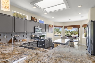 Uniquely positioned with picturesque views of both the on Sun City Grand Golf Couse and Club in Arizona - for sale on GolfHomes.com, golf home, golf lot