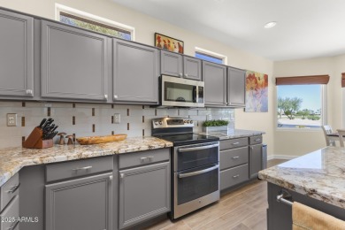 Uniquely positioned with picturesque views of both the on Sun City Grand Golf Couse and Club in Arizona - for sale on GolfHomes.com, golf home, golf lot