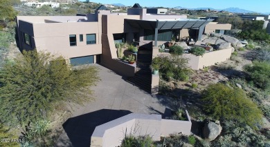 Set among giant boulders outside & inside the home, this on Desert Mountain - Outlaw Golf Course in Arizona - for sale on GolfHomes.com, golf home, golf lot