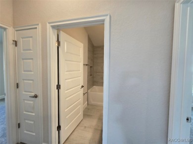 The 1820 plan is available in a cul-de-sac location within a on Twisted Oaks Golf Club in Florida - for sale on GolfHomes.com, golf home, golf lot