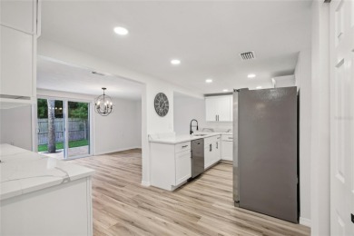 Welcome to your slice of paradise in the GOLF-CART friendly on Gulf Harbors Golf Course in Florida - for sale on GolfHomes.com, golf home, golf lot