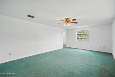 Located in an established neighborhood near the New Smyrna Beach on New Smyrna Beach Golf Course in Florida - for sale on GolfHomes.com, golf home, golf lot