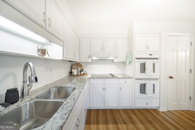 Welcome to 300 Woodchuck Court, ideally located in the on Horseshoe Bend Country Club in Georgia - for sale on GolfHomes.com, golf home, golf lot