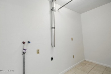Located in an established neighborhood near the New Smyrna Beach on New Smyrna Beach Golf Course in Florida - for sale on GolfHomes.com, golf home, golf lot