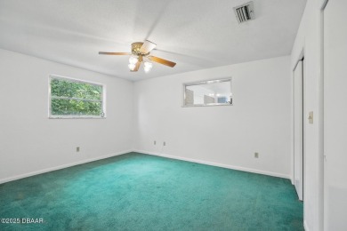 Located in an established neighborhood near the New Smyrna Beach on New Smyrna Beach Golf Course in Florida - for sale on GolfHomes.com, golf home, golf lot