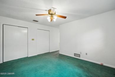 Located in an established neighborhood near the New Smyrna Beach on New Smyrna Beach Golf Course in Florida - for sale on GolfHomes.com, golf home, golf lot