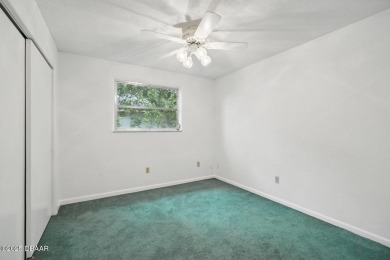 Located in an established neighborhood near the New Smyrna Beach on New Smyrna Beach Golf Course in Florida - for sale on GolfHomes.com, golf home, golf lot