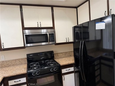 Great view! two-story of La Vista condo with dual master suites on El Niguel Country Club in California - for sale on GolfHomes.com, golf home, golf lot