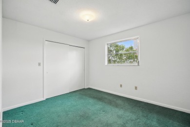Located in an established neighborhood near the New Smyrna Beach on New Smyrna Beach Golf Course in Florida - for sale on GolfHomes.com, golf home, golf lot