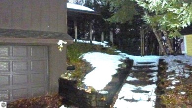 This home in the attractive Michabou Shores Subdivision is about on Crystal Downs Country Club in Michigan - for sale on GolfHomes.com, golf home, golf lot
