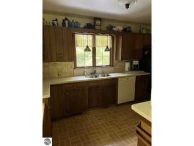 This home in the attractive Michabou Shores Subdivision is about on Crystal Downs Country Club in Michigan - for sale on GolfHomes.com, golf home, golf lot