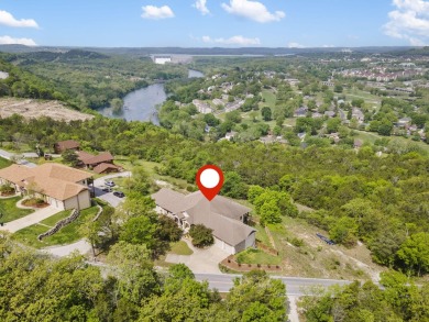 Gorgeous views from this home perched on a hilltop overlooking on Pointe Royale Village Country Club in Missouri - for sale on GolfHomes.com, golf home, golf lot