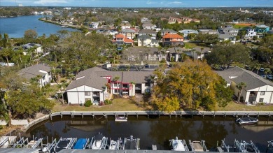 Experience waterfront living at its finest in historic Tarpon on Tarpon Springs Golf Course in Florida - for sale on GolfHomes.com, golf home, golf lot