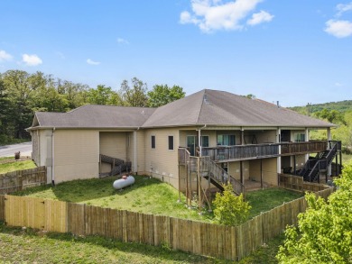 Gorgeous views from this home perched on a hilltop overlooking on Pointe Royale Village Country Club in Missouri - for sale on GolfHomes.com, golf home, golf lot