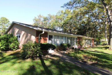 This cozy house is unique with two exits; one of which opens to on Greenbriar Woodlands in New Jersey - for sale on GolfHomes.com, golf home, golf lot