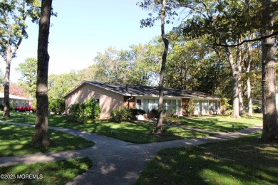 This cozy house is unique with two exits; one of which opens to on Greenbriar Woodlands in New Jersey - for sale on GolfHomes.com, golf home, golf lot