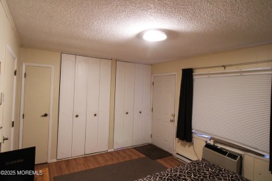 This cozy house is unique with two exits; one of which opens to on Greenbriar Woodlands in New Jersey - for sale on GolfHomes.com, golf home, golf lot