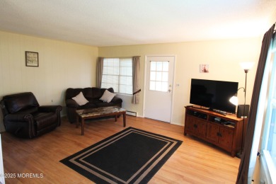 This cozy house is unique with two exits; one of which opens to on Greenbriar Woodlands in New Jersey - for sale on GolfHomes.com, golf home, golf lot