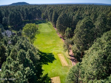 Located on the 11th tee of Pinetop Lakes Golf and Country Club on Pinetop Lakes Golf and Country Club in Arizona - for sale on GolfHomes.com, golf home, golf lot