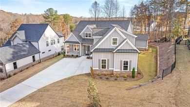 Located in the desirable Traditions of Braselton community on on Traditions of Braselton Golf Club in Georgia - for sale on GolfHomes.com, golf home, golf lot