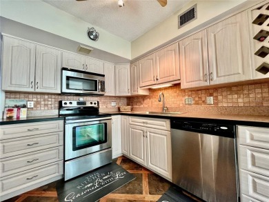 Move into this 2 bed/2 bath, turnkey-furnished condo, located on On Top Of The World Golf Course in Florida - for sale on GolfHomes.com, golf home, golf lot