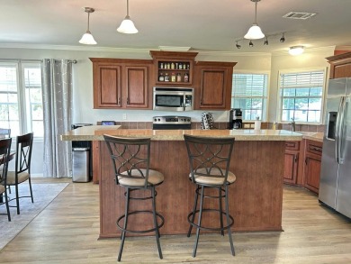 Like-new 2-bedroom, 2-bathroom home in a peaceful 55+ community on Fairways Country Club in Florida - for sale on GolfHomes.com, golf home, golf lot