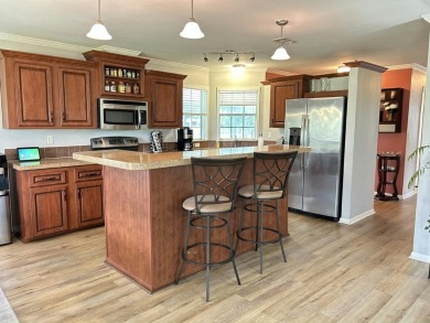 Like-new 2-bedroom, 2-bathroom home in a peaceful 55+ community on Fairways Country Club in Florida - for sale on GolfHomes.com, golf home, golf lot