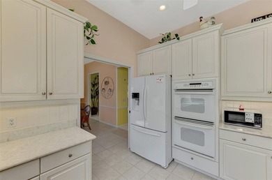 BEAUTIFUL HOME with POND and GOLF COURSE VIEWS! Situated on a on Boca Royale Golf and Country Club in Florida - for sale on GolfHomes.com, golf home, golf lot