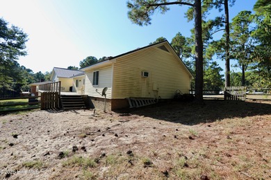 Excellent price on updated golf front beauty! Located just on Seven Lakes Country Club in North Carolina - for sale on GolfHomes.com, golf home, golf lot