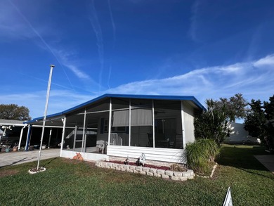 This 2-bedroom, 2-bath home offers 1,296 sq ft of comfortable on Lake Henry Golf Club in Florida - for sale on GolfHomes.com, golf home, golf lot