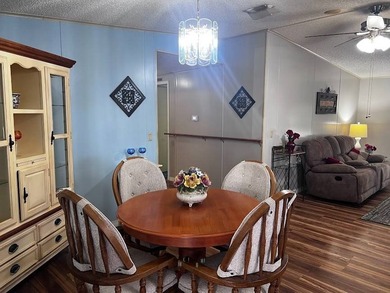 This 2-bedroom, 2-bath home offers 1,296 sq ft of comfortable on Lake Henry Golf Club in Florida - for sale on GolfHomes.com, golf home, golf lot