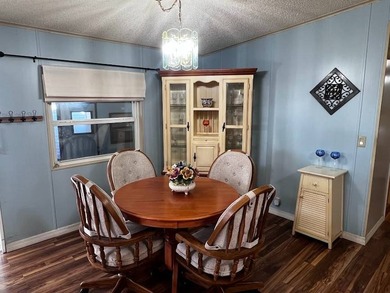 This 2-bedroom, 2-bath home offers 1,296 sq ft of comfortable on Lake Henry Golf Club in Florida - for sale on GolfHomes.com, golf home, golf lot