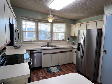 This 2-bedroom, 2-bath home offers 1,296 sq ft of comfortable on Lake Henry Golf Club in Florida - for sale on GolfHomes.com, golf home, golf lot