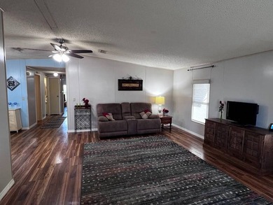 This 2-bedroom, 2-bath home offers 1,296 sq ft of comfortable on Lake Henry Golf Club in Florida - for sale on GolfHomes.com, golf home, golf lot