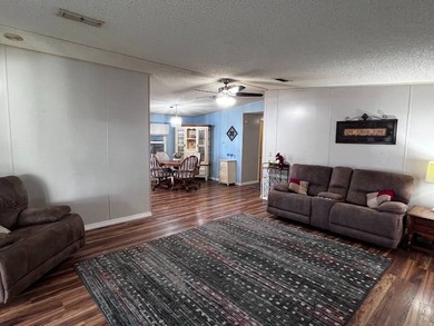 This 2-bedroom, 2-bath home offers 1,296 sq ft of comfortable on Lake Henry Golf Club in Florida - for sale on GolfHomes.com, golf home, golf lot