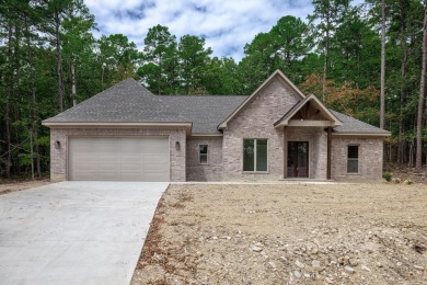 Full brick exterior surrounded by woods and backing to wooded on Ponce De Leon Golf Course in Arkansas - for sale on GolfHomes.com, golf home, golf lot