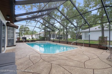POOL HOME,  Enjoy this pool with spa home with 2021 pool heater on Timber Pines Golf Course in Florida - for sale on GolfHomes.com, golf home, golf lot