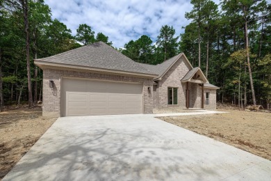 Full brick exterior surrounded by woods and backing to wooded on Ponce De Leon Golf Course in Arkansas - for sale on GolfHomes.com, golf home, golf lot