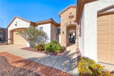 Immaculate Trenton model with mountain & city views! This on Revere Golf Club in Nevada - for sale on GolfHomes.com, golf home, golf lot