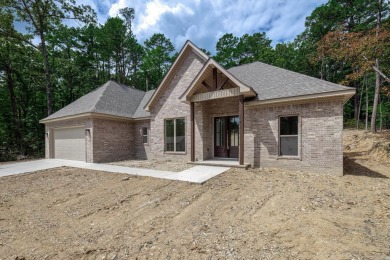 Full brick exterior surrounded by woods and backing to wooded on Ponce De Leon Golf Course in Arkansas - for sale on GolfHomes.com, golf home, golf lot