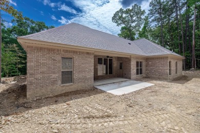 Full brick exterior surrounded by woods and backing to wooded on Ponce De Leon Golf Course in Arkansas - for sale on GolfHomes.com, golf home, golf lot