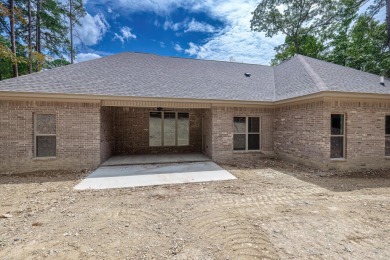 Full brick exterior surrounded by woods and backing to wooded on Ponce De Leon Golf Course in Arkansas - for sale on GolfHomes.com, golf home, golf lot