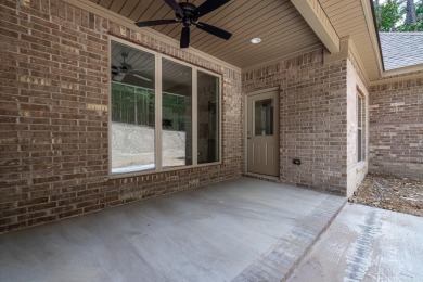 Full brick exterior surrounded by woods and backing to wooded on Ponce De Leon Golf Course in Arkansas - for sale on GolfHomes.com, golf home, golf lot