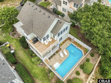 Turn-key 4-bedroom, 3.5-bath home with a private pool in The on The Currituck Golf Club in North Carolina - for sale on GolfHomes.com, golf home, golf lot