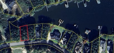 Build your dream home on this level wooded home site located at on The Patriot Golf Club At Grand Harbor in South Carolina - for sale on GolfHomes.com, golf home, golf lot