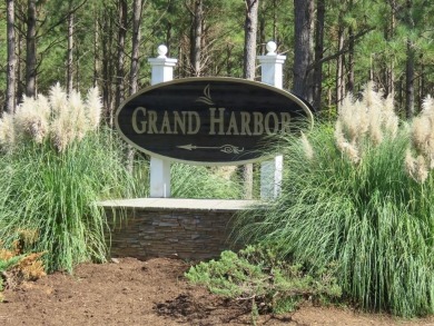 Build your dream home on this level wooded home site located at on The Patriot Golf Club At Grand Harbor in South Carolina - for sale on GolfHomes.com, golf home, golf lot