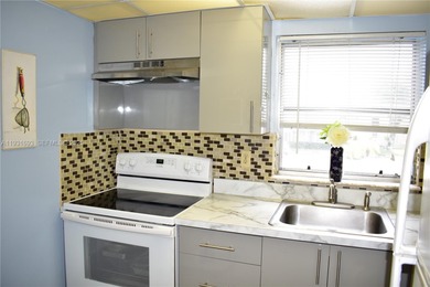 This is a really wonderful condo for someone who loves the sun! on Sunrise Lakes Phase III in Florida - for sale on GolfHomes.com, golf home, golf lot