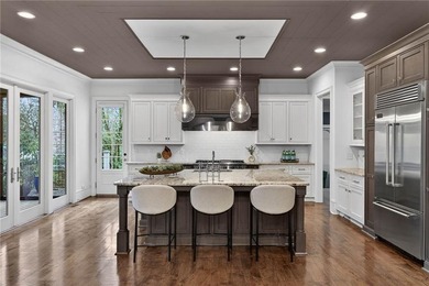 Just steps from Chastain Park, this exceptional five-bedroom on North Fulton Golf Course in Georgia - for sale on GolfHomes.com, golf home, golf lot